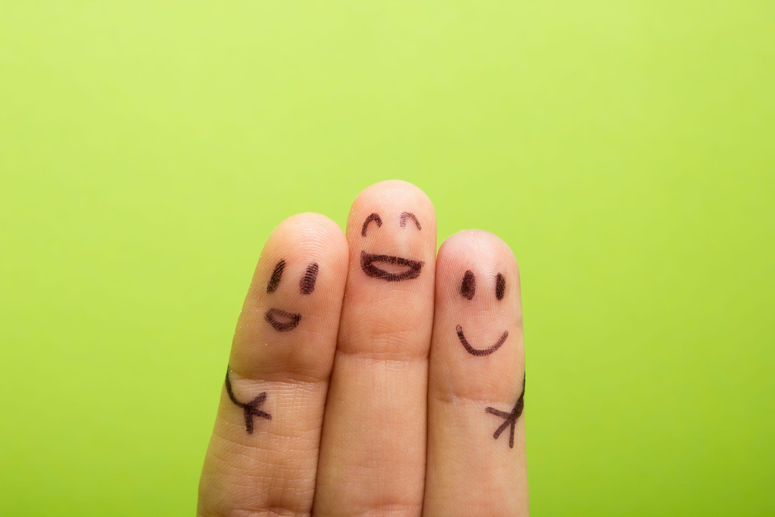 three smiling fingers that are very happy to be friends, family concept